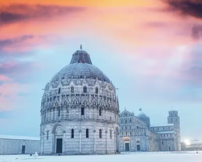 Baptistery of Pisa after a winter snowfall at dusk. Square of Miracles at dawn.
