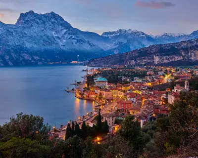 Christmas lights adorning the city center and Riva del Garda Street, View of the beautiful Riva del Garda town by night,Italy